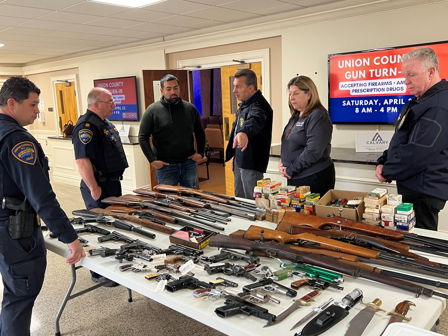   Union County Police Department Captain John DaSilva, Union County Police Captain Martin Mogensen,  Union County Commissioner Sergio Granados,  Union County Prosecutor William A. Daniel, Union  County Commissioner Lourdes Leon , Union County First Assistant Prosecutor James Tansey.