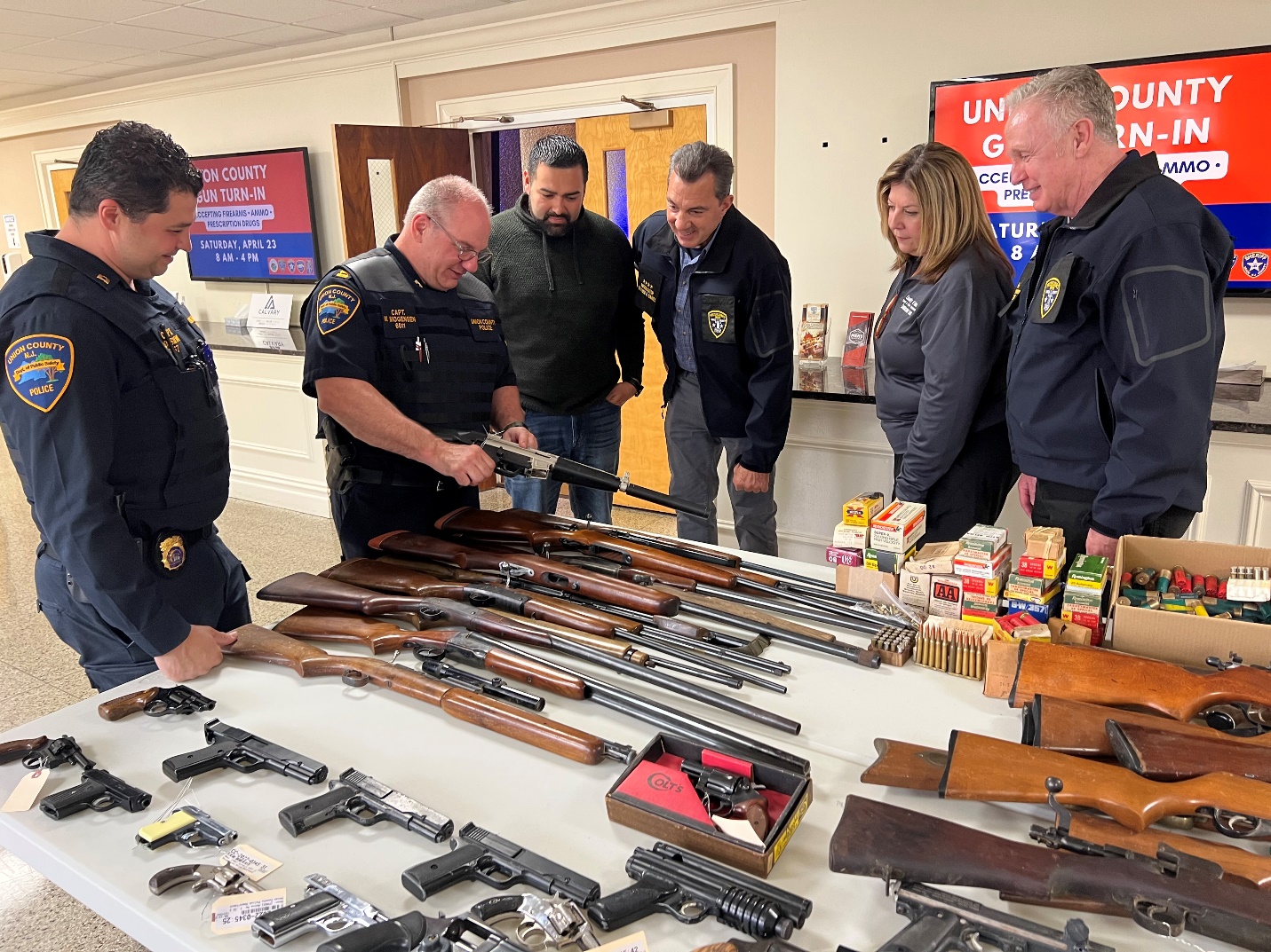   Union County Police Department Captain John DaSilva, Union County Police Captain Martin Mogensen,  Union County Commissioner Sergio Granados,  Union County Prosecutor William A. Daniel, Union  County Commissioner Lourdes Leon , Union County First Assistant Prosecutor James Tansey.