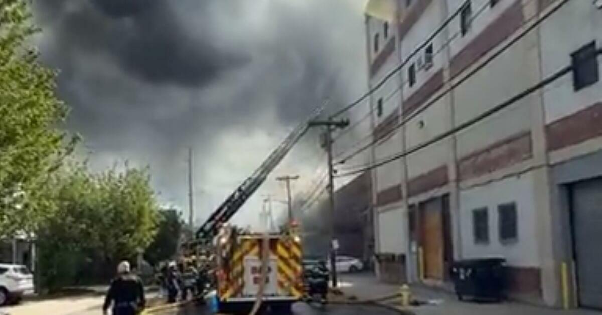 9-Alarm Massive Fire Engulfs Belleville Building, Spreads to Second Structure